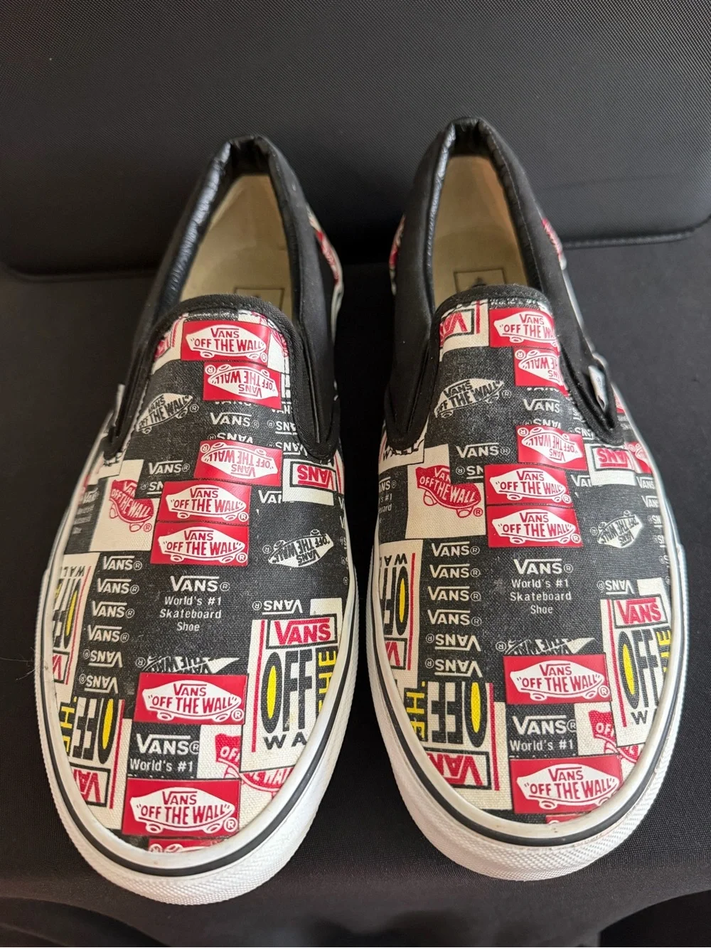 Vans Slip-On Sneakers in Black, White & Red Logo Print